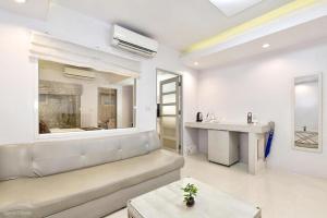 a living room with a couch and a table at NanNakara Boutique Hotel in Nan +225 photos