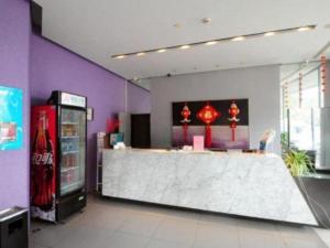 a coca cola machine and a counter in a store at Jinjiang Inn Zhoushan Putuo Shenjiamen in Xi'ao