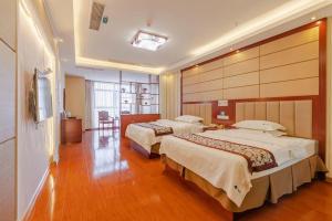 Postel nebo postele na pokoji v ubytování GreenTree Inn Chuzhou City Quanjiao County High-Speed Italy Trade City Business Hotel