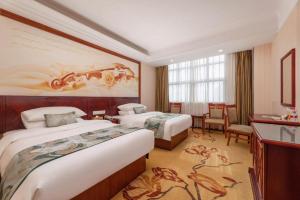 Postel nebo postele na pokoji v ubytování Vienna International Hotel Shanghai Songjiang Branch + 224 fotografií