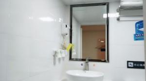 a bathroom with a sink and a mirror at 7 Days Premium Zunyi Conference Site Dingzikou in Zunyi +24 photos
