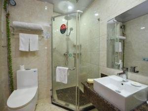 a bathroom with a toilet and a sink and a shower at GreenTree Inn Anhui Yaohai District MingGuang Road Bus Station Express Hotel in Hefei