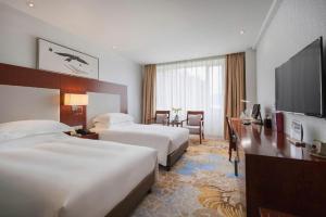TV a/nebo společenská místnost v ubytování Xiamen Airlines Quanzhou Hotel