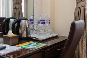 a table with bottles of water on top of it at Hotel Sapana Garden Thamel in Kathmandu