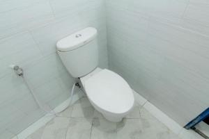 a bathroom with a white toilet in a room at Hostel Backpackers 44 in Yogyakarta