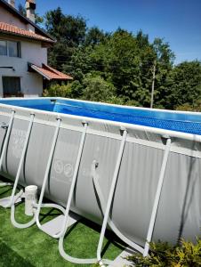 a white swimming pool fence with a pool noodle at Villa Diva in Apriltsi