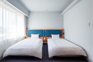 Postel nebo postele na pokoji v ubytování Hotel Global View Tsuchiura