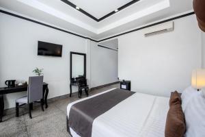 TV a/nebo společenská místnost v ubytování La Da Kiri Boutique Hotel