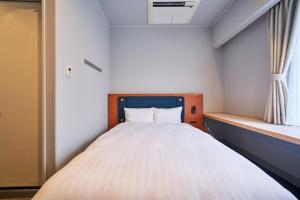 Postel nebo postele na pokoji v ubytování Hotel Global View Tsuchiura