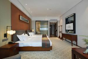 Postel nebo postele na pokoji v ubytování Rezen Hotel Pasonda Junyu + 238 fotografií