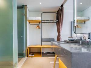 a bathroom with a sink and a counter top at ibis xian North Second Ring Weiyang Rd Hotel in Xi'an +253 photos