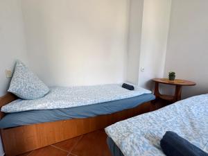 Postel nebo postele na pokoji v ubytování Pensjonat Lemon