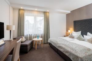 Postel nebo postele na pokoji v ubytování Best Western Hotel Lamm
