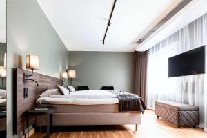 Postel nebo postele na pokoji v ubytování Scandic Uplandia