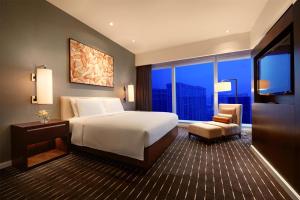 Voodi või voodid majutusasutuse Grand Hyatt Macau toas