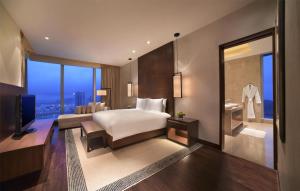 Voodi või voodid majutusasutuse Grand Hyatt Macau toas