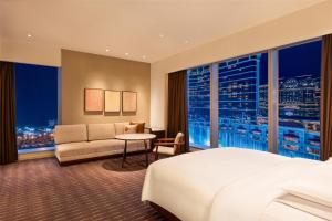 Voodi või voodid majutusasutuse Grand Hyatt Macau toas