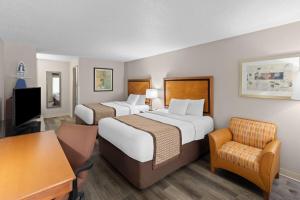 Un ou plusieurs lits dans un hébergement de l'établissement Baymont by Wyndham Knoxville I-75