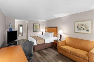 Un ou plusieurs lits dans un hébergement de l'établissement Baymont by Wyndham Knoxville I-75