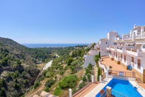 a view of a villa with a swimming pool at Casa Dorit Frigiliana in Frigiliana