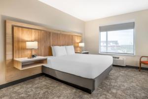 Ένα ή περισσότερα κρεβάτια σε δωμάτιο στο Radisson Hotel Pendleton Airport