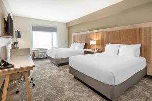 Ένα ή περισσότερα κρεβάτια σε δωμάτιο στο Radisson Hotel Pendleton Airport