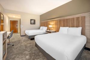 Ένα ή περισσότερα κρεβάτια σε δωμάτιο στο Radisson Hotel Pendleton Airport