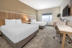 Ένα ή περισσότερα κρεβάτια σε δωμάτιο στο Radisson Hotel Pendleton Airport