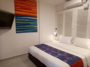 Postel nebo postele na pokoji v ubytování Beach Box Perhentian