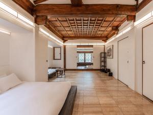 Voodi või voodid majutusasutuse Rakkojae Hahoe Hanok Hotel toas