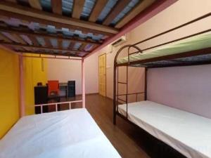 Postel nebo postele na pokoji v ubytování SPOT ON 90119 Bed's Guesthouse