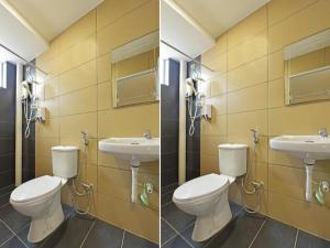 ムアルにあるCapital O 90674 4S Hotelのバスルーム(トイレ2つ、シンク2つ付) +52枚の写真