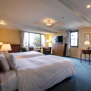 Ένα ή περισσότερα κρεβάτια σε δωμάτιο στο Hotel Eclair Hakata +255 φωτογραφίες