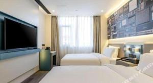 Katil atau katil-katil dalam bilik di 7 Days Inn Baoding Railway Station