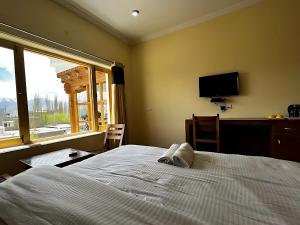 Ένα ή περισσότερα κρεβάτια σε δωμάτιο στο Sixteen Arahat guest house