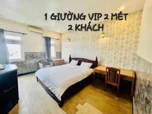 Giường trong phòng chung tại RUBY HOTEL