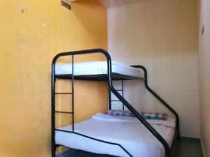 Giường trong phòng chung tại SPOT ON 90984 Gn Homestay