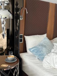 Voodi või voodid majutusasutuse Tivoli Hotel toas