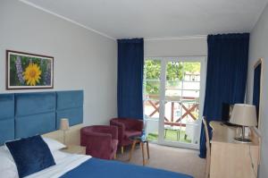 Postel nebo postele na pokoji v ubytování B&B Landrynka