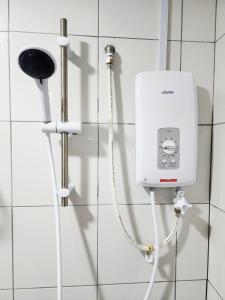 a white box on a wall in a bathroom at Malacca 3 bedroom Seri Serindit 07 in Melaka