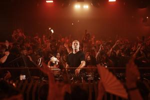 a man standing in front of a crowd at Pacha Hotel in Ibiza Town