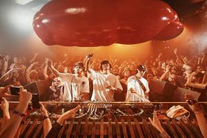 a crowd of people with their hands up at a concert at Pacha Hotel in Ibiza Town