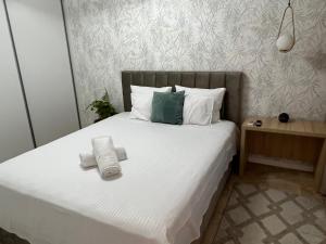 Postel nebo postele na pokoji v ubytování Vila Nicolas