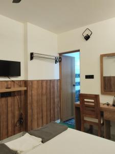 Televiisor ja/või meelelahutuskeskus majutusasutuses Anantha Guest House