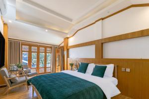 Postel nebo postele na pokoji v ubytování Yueju Designer Homestay