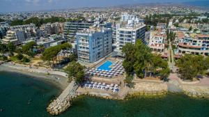 an aerial view of a city with a beach and buildings at Harmony Bay Hotel in Limassol
