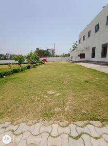 an empty yard in front of a building at Non AC Room Near IIM College in Lucknow