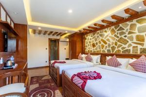 Postel nebo postele na pokoji v ubytování Amarawati Boutique Hotel + 37 fotografií