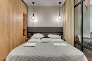 Ένα ή περισσότερα κρεβάτια σε δωμάτιο στο Montevideo Centrum 2 by Grand Apartments