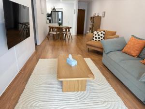 a living room with a couch and a coffee table at Soldiers Point Escape in Soldiers Point